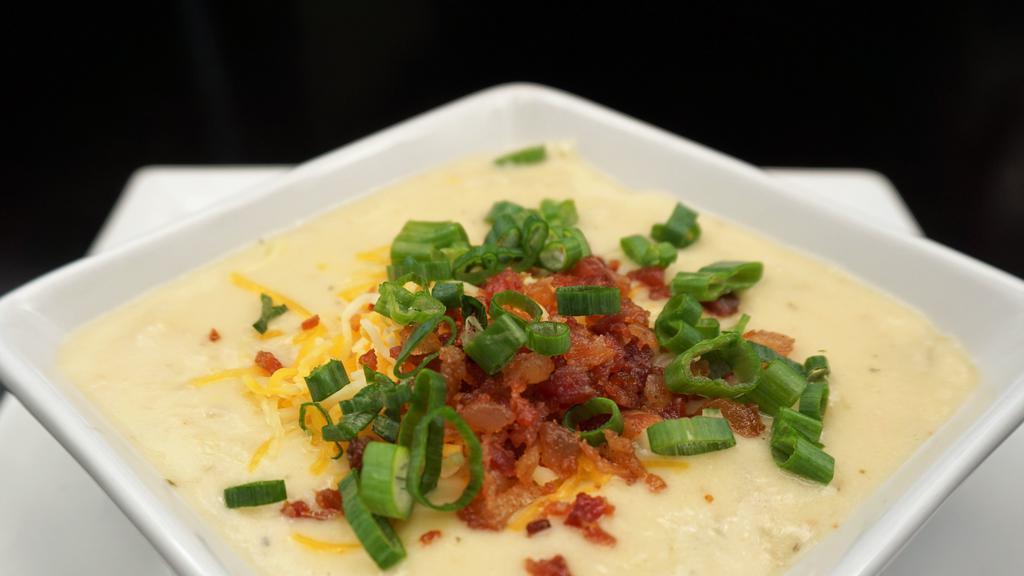 *Loaded Potato Soup Bowl* · House-made with Potatoes, Cream & Spices & topped with Cheddar-jack, Chopped Bacon & Chives.