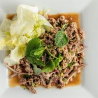 Larb · ground meat salad in rice powder, onions and lime dressing.
