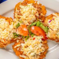 Playeros · Gluten free. Tostones topped with your choice of shredded beef, pork or chicken with colesla...