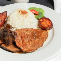 Asado Negro · Beef slowly cooked in its own savory sauce. Served with rice and fried plantains .