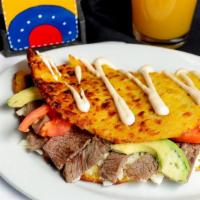 Cachapa Llanera · Grilled steak, tomato, avocado and cheese.