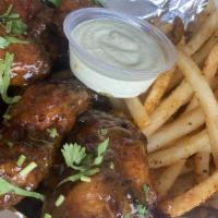 Chicken Wings · Six jumbo wings marinated and rubbed with secret seasoning. Served with fries and your choic...