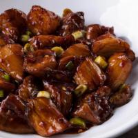 Stir-Fried Spicy Eggplant · Tossed with scallions and fiery sauce