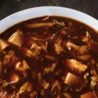 Hot & Sour Soup · Chicken, bean curd, bamboo shoots,& mushrooms, sparked with hot white pepper and vinegar