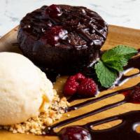 Chocolate Lava Cake · blackberry cardamom sauce, vanilla ice cream