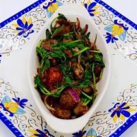 Lamb Tibs With Spinach · Tender cubed lamb marinated with our own signature sauce toasted with spinach, red onions, t...