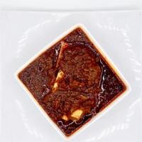 Spicy Lamb Stew (Key Wot) · Lamb meat stewed with kategna special sauce onion, garlic, ginger, berbere, and finished wit...
