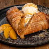 Peach Cobbler Pie Crusted Rolls · Filled with cinnamon sliced peaches and caramelized sauce served with our homemade premium v...