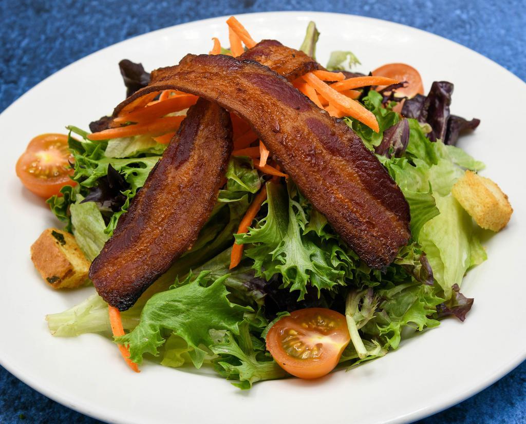 The Grille Salad · Cherry tomatoes, carrot, butcher-cut bacon, garlic croutons, vinaigrette.