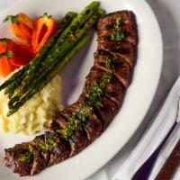 Churrasco · 10 ounce grilled skirt steak, chimichurri sauce, grilled asparagus and choice of two sides.