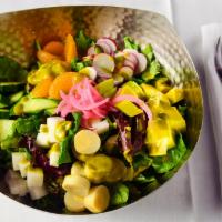 Chop Salad · Avocado, hearts of palm, radish, cucumber, mandarin, avocado cilantro-lime dressing.
