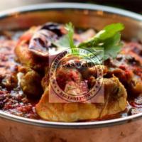 Andhra Chicken Curry · Chicken cooked with tomatoes, caramelized onions & spices in traditional southern indian sty...