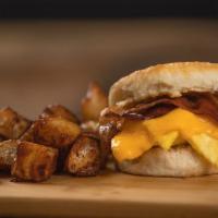 Bacon (Or Sausage) Egg & Cheese Biscuit · Your choice of bacon or a sausage patty, egg, and American cheese on a grilled biscuit. Serv...