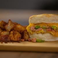 Denver Omelet Biscuit · A flakey biscuit featuring diced ham, onions, peppers, and Cheddar cheese cooked up into two...