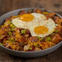 Bacon Or Sausage Loaded Home Fry Bowl · Home fries topped with onions, peppers, cheddar cheese, two eggs, and your choice of bacon o...