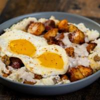 Southern Bowl · A bowl that begins with creamy grits and home fries, then topped with savory sausage crumble...