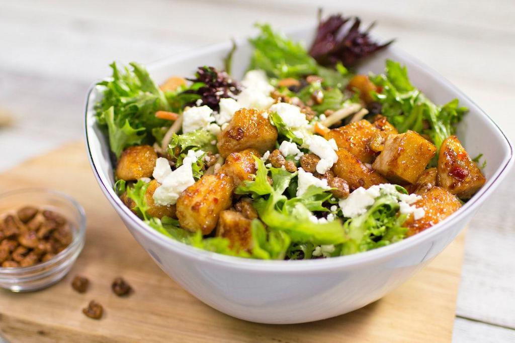 Praline Pecan Chicken Salad · Diced chicken breast and mixed greens tossed in Blueberry Pomegranate dressing with praline pecans and feta cheese crumbles.