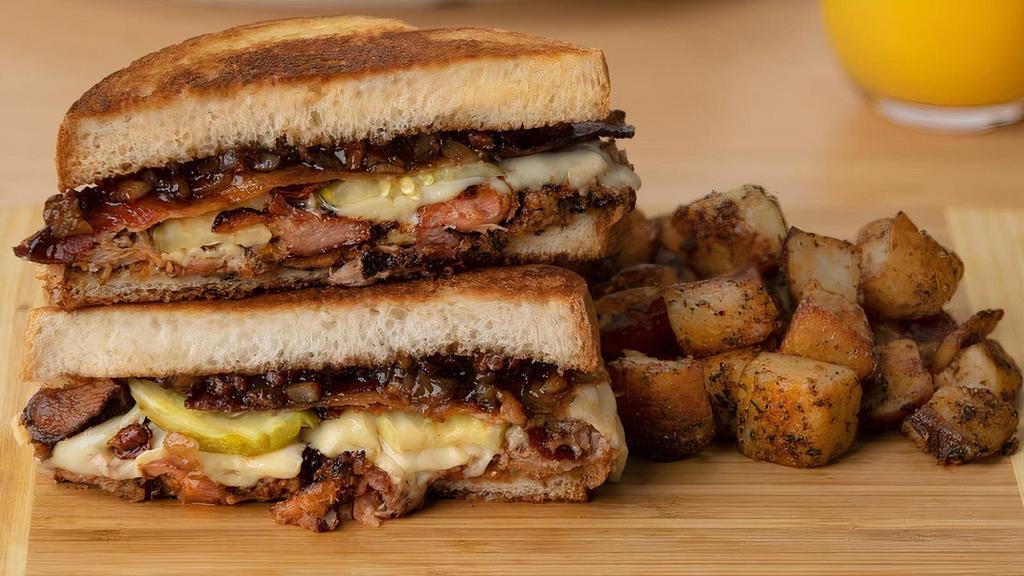 The Perfect Pig · Smoked pork, bacon, pickles, Swiss cheese and bacon jam on grilled Texas toast.  Served with home fries, potato salad or chips and a pickle.