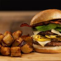 Brunch Burger · A steak burger stacked with a mushroom and onion omelet, Swiss cheese, crispy bacon, and fre...