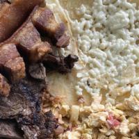 Calentado Trancado · Rice mixed with beans and served with fried pork belly, grilled steak, scrambled eggs, corn ...