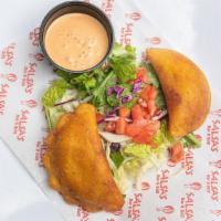 Empanadas · Two Mexican turnovers stuffed with your choice of filling (Smokey Chicken Tinga, or Ground B...