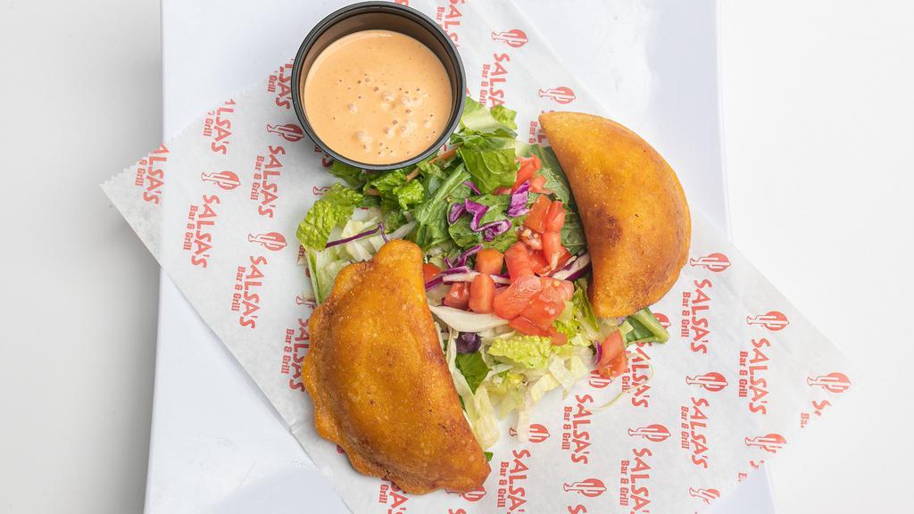 Empanadas · Two Mexican turnovers stuffed with your choice of filling (Smokey Chicken Tinga, or Ground Beef and cheese).