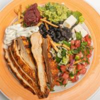Santa Fe Chicken Salad · Grilled chicken, served on a bed of lettuce, topped with black beans, pico de gallo, crispy ...