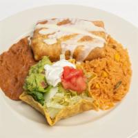 Chimichanga · One flour tortilla, soft or deep fried filled with beef tips on shredded chicken. Topped wit...