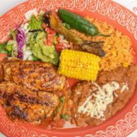 Pollo Parrilla · Tortilla included. Grilled marinated boneless chicken breasr served over a our special roast...