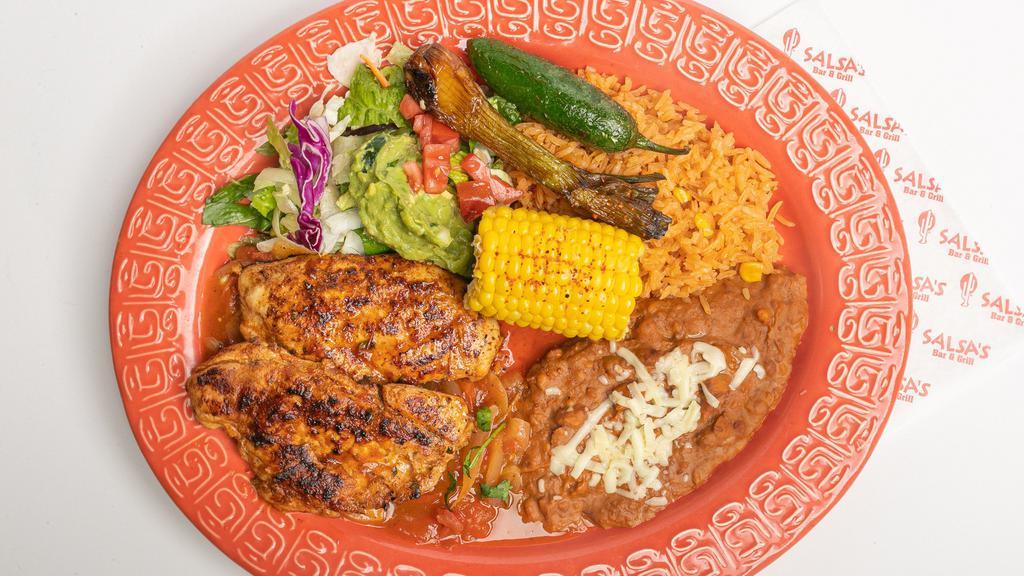 Pollo Parrilla · Tortilla included. Grilled marinated boneless chicken breasr served over a our special roasted Mexican style sauce cooked with olive oil then topped with cambray onion, corn on the cobb and jalapeño. Served with rice, beans, guacamole salad, and tortillas.