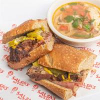 Cuban Sandwich · Cuban style sub stuffed with carnitas, ham, mustard and pickles. Served with a cup of chicke...