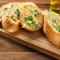 Garlic Cheese Bread · Freshly baked bread topped with cheese, basil, garlic, and olive oil served with a side of r...