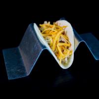 Kid'S Chicken Taco · rotisserie chicken, smoked cheddar, flour tortilla (Optimist Hall chicken taco is made with ...