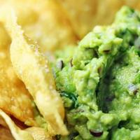 Guacamole Chips · Fresh made guacamole served with crispy chips.
