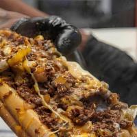 Philly Cheesesteak · Our Philly's are one of a kind! Thinly sliced rib eye steak with caramelized onions, sautéed...