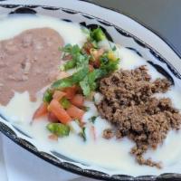 Cheese Dip Deluxe · Beef,beans and pico de gallo wih cheese dip.