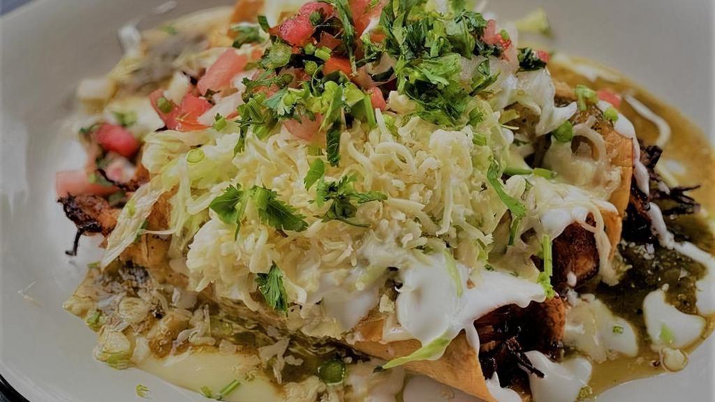 Pollo Tradicionales · Rolled and fried corn tortilla tacos, served with cheese dip, pico de gallo, lettuce, sour cream, salsa verde and shredded Cheese.