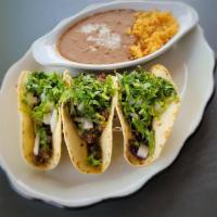 Street Tacos · Ground beef tacos sautéed with salsa verde. Served with fresh onions and cilantro.