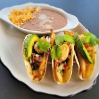 Grilled Fish Tacos · Blackened tilapia, avocado, chipotle mayo, pico de gallo.