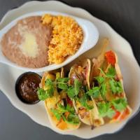 Veggie Tacos · Grilled zucchini, mushroom, cauliflower, peppers, onions & chipotle salsa.