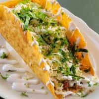 Taco Loco/ Chicken · Giant crispy taco shell, seasoned shredded chicken or beef, cheese dip, lettuce, cilantro & ...