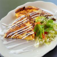 Steak Quesadilla · Giant flour tortilla grilled with choice of meat and melted cheese. Served with lettuce, tom...