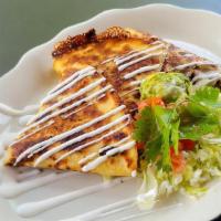 Veggie Quesadilla · Giant flour tortilla with choice of meat and melted cheese. served with lettice, tomato, sou...