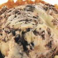Kilwins® Tracks Quart · Creamy vanilla-flavored ice cream with chocolate-covered peanut butter truffles & swirls of ...