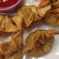 Crab Rangoon (5) · Fried wonton skin filled with cream cheese and crabmeat with a hint of curry.