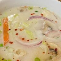 Coconut Soup (Tom Kah) (Large) · Cream of coconut soup with mushroom, cabbage and onion flavored with lemon grass topped with...
