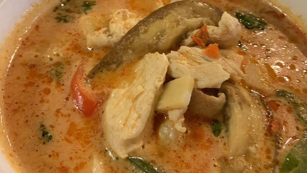 Thai Red Curry · Red curry paste in coconut milk with bamboo shoot, pineapple, eggplant slices, bell pepper and sweet basil.