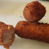 Croquetas - Jamon · 4pc served w/ lime and a spicy vinaigrette.