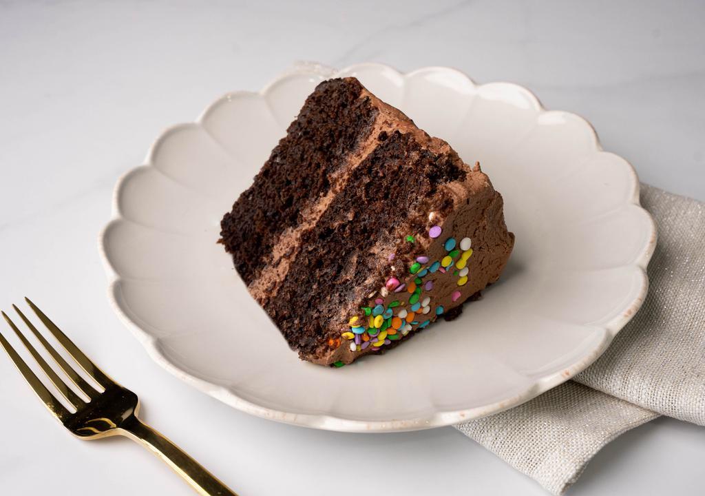 Chocolate Cake Slice · A slice of our moist chocolate cake, frosted with chocolate buttercream frosting.