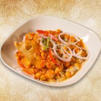 Melting Samosa Chaat · Classic samosas crushed and mixed with hot, sweet and tangy sauces, yogurt and topped with f...